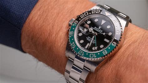 hand with rolex on it|Rolex clock hands.